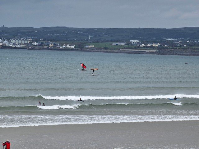 A few wing foils out on the water today as a few beginner surfers hang out in the shallows